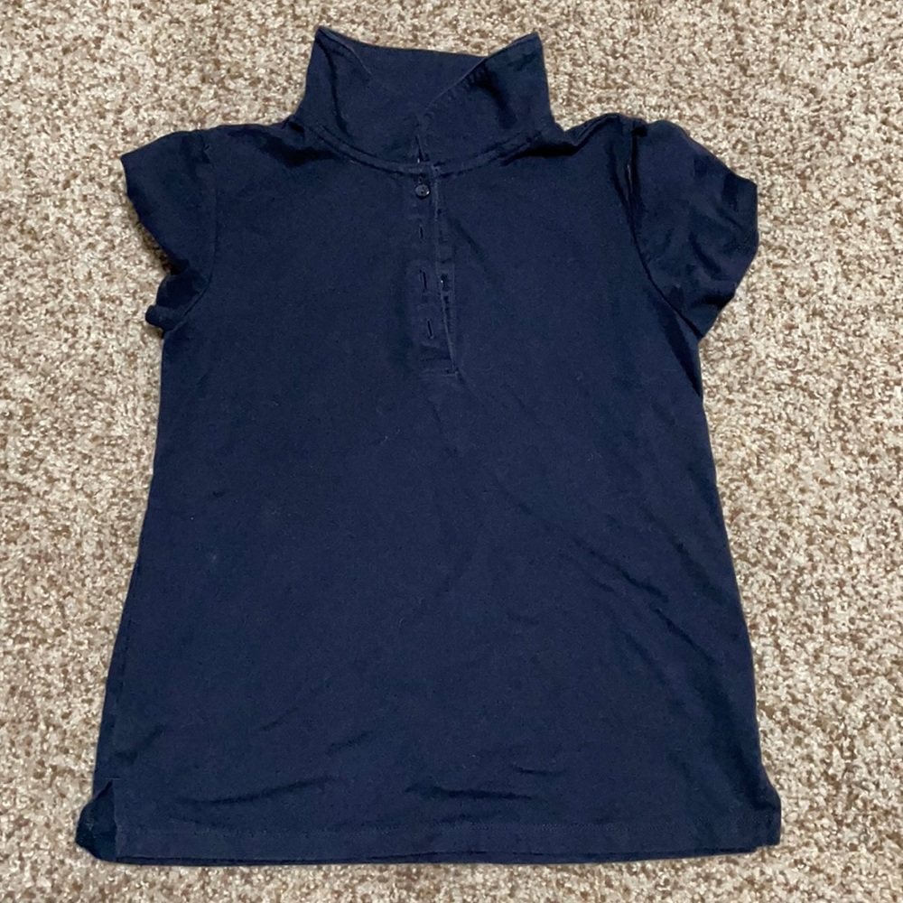 Two navy Gap polos one still in plastic.